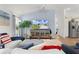 Open concept living room with a TV and coastal decor at 1478 Erika Pl, The Villages, FL 32163