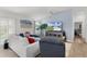 This bright and airy living room has ample seating at 1478 Erika Pl, The Villages, FL 32163
