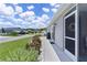 Side of the home featuring a screened in porch, well-maintained landscaping, and a paved walkway at 1478 Erika Pl, The Villages, FL 32163