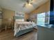 This bedroom features a vaulted ceiling, ceiling fan, and view to the lanai and pool at 15509 Markham Dr, Clermont, FL 34714