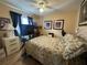 Cozy bedroom featuring a comfortable bed, soft lighting, and stylish decor for relaxation at 15509 Markham Dr, Clermont, FL 34714