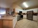 Well-equipped kitchen features stainless steel appliances, modern cabinets, and ample counter space at 15509 Markham Dr, Clermont, FL 34714