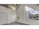 A bedroom with two large windows, two closets and painted concrete floors at 1603 Woodward St # 18, Orlando, FL 32803