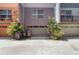 Townhome garages and exterior featuring colorful facades and lush landscaping in front at 1603 Woodward St # 18, Orlando, FL 32803