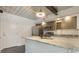 Modern kitchen with stainless steel appliances, granite countertops, and ample cabinet space at 1603 Woodward St # 18, Orlando, FL 32803