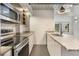 Modern kitchen featuring stainless steel appliances, granite countertops, and lots of counter space at 1603 Woodward St # 18, Orlando, FL 32803