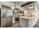Spacious kitchen featuring stainless steel appliances, granite countertops, and ample natural light at 1603 Woodward St # 18, Orlando, FL 32803
