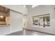 Open-concept living space with a high ceiling and an inviting view through the large window at 1603 Woodward St # 18, Orlando, FL 32803