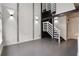 Modern living space featuring a unique staircase, and stylish lighting fixtures at 1603 Woodward St # 18, Orlando, FL 32803