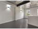 Bright living room featuring a metal ceiling, modern lighting, and neutral walls at 1603 Woodward St # 18, Orlando, FL 32803