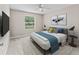 Bedroom with carpet flooring, ceiling fan, and a window for natural light at 1948 Harston Trl, The Villages, FL 32162