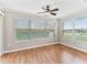 Bright room offers serene view through expansive windows, creating a peaceful atmosphere at 1948 Harston Trl, The Villages, FL 32162