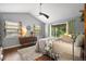 Bedroom with natural light, hardwood floors, and a ceiling fan at 2108 Dogwood Cir, Mount Dora, FL 32757