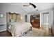 Bedroom featuring hardwood floors, a ceiling fan, and neutral walls at 2108 Dogwood Cir, Mount Dora, FL 32757