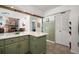 Eat-in kitchen with stone fireplace and a decorative surfboard at 2108 Dogwood Cir, Mount Dora, FL 32757