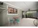 Enclosed patio with a small table and chairs, providing a cozy outdoor space at 2108 Dogwood Cir, Mount Dora, FL 32757