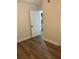 Bedroom view leading into an ensuite bathroom, complete with new vinyl flooring at 228 Cannon Way, Casselberry, FL 32707