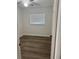 This bedroom has a window with blinds, vinyl flooring, and a ceiling fan at 228 Cannon Way, Casselberry, FL 32707