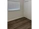 Bright bedroom featuring wood-look flooring and a window at 228 Cannon Way, Casselberry, FL 32707