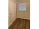 Bedroom with wood floor, large closet and light from window at 228 Cannon Way, Casselberry, FL 32707