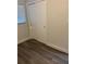 Bedroom featuring updated vinyl flooring, window, and ample closet space at 228 Cannon Way, Casselberry, FL 32707