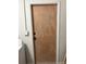 Plywood door with white trim at 228 Cannon Way, Casselberry, FL 32707