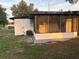 Rear exterior of home, screened porch and AC unit at 228 Cannon Way, Casselberry, FL 32707