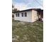 Low angle side view of a white home with black shutters at 228 Cannon Way, Casselberry, FL 32707