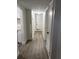 Hallway with modern vinyl flooring leading to various rooms, enhancing the home's appeal at 228 Cannon Way, Casselberry, FL 32707