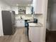 Spacious kitchen with stainless steel appliances, white cabinets and modern countertops at 228 Cannon Way, Casselberry, FL 32707