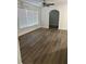 Bright living room with updated vinyl flooring, featuring an archway and ceiling fan at 228 Cannon Way, Casselberry, FL 32707