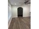 Bright living room with archway, updated vinyl flooring, and a ceiling fan at 228 Cannon Way, Casselberry, FL 32707