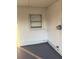 Enclosed porch with gray concrete floor, window and utility hookups at 228 Cannon Way, Casselberry, FL 32707