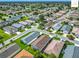 Beautiful aerial view showcasing a neighborhood with manicured lawns and lush landscaping, a serene community at 2311 Pine Ridge St, The Villages, FL 32162