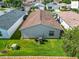 Aerial view reveals backyard of home, green space, privacy, and mature landscaping at 2311 Pine Ridge St, The Villages, FL 32162