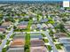 An elevated shot captures a serene neighborhood, highlighting its organized layout and vibrant green spaces at 2311 Pine Ridge St, The Villages, FL 32162