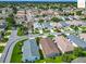 A charming neighborhood featuring well-maintained lawns, mature trees, and inviting single-story homes at 2311 Pine Ridge St, The Villages, FL 32162