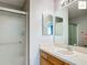 Bathroom featuring a vanity with an oval sink and a sliding glass door shower at 2311 Pine Ridge St, The Villages, FL 32162