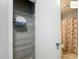 Bathroom closet with shelving and towels at 2311 Pine Ridge St, The Villages, FL 32162