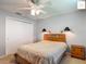 Cozy bedroom with carpet, ceiling fan, and double closet at 2311 Pine Ridge St, The Villages, FL 32162
