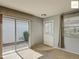 Bright living room with carpet, sliding glass door, and lots of natural light at 2311 Pine Ridge St, The Villages, FL 32162