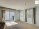 Cozy living room with carpet, sliding glass door, and neutral paint at 2311 Pine Ridge St, The Villages, FL 32162