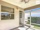 Cozy screened porch with ceiling fan, perfect for relaxing and enjoying the outdoors at 2311 Pine Ridge St, The Villages, FL 32162