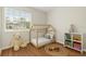 Charming bedroom with wood floors, house frame bed, and a bright window at 2311 Vincent Rd, Orlando, FL 32817