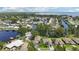 Aerial view of a waterfront community with canals, docks, and lush greenery, showcasing serene water living at 2512 Baywater Rd, Tavares, FL 32778
