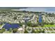 Aerial view of waterfront community with canal access to a large lake at 2512 Baywater Rd, Tavares, FL 32778
