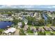 Aerial view of canal front homes showing lush landscaping at 2512 Baywater Rd, Tavares, FL 32778