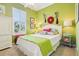 Charming bedroom with a white bed, a ceiling fan, and a view of the outdoors at 2512 Baywater Rd, Tavares, FL 32778