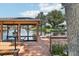 Private dock with covered boathouse overlooking waterfront canal on a sunny day at 2512 Baywater Rd, Tavares, FL 32778