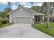 Charming single-story home with well-manicured landscaping and two-car garage at 2512 Baywater Rd, Tavares, FL 32778